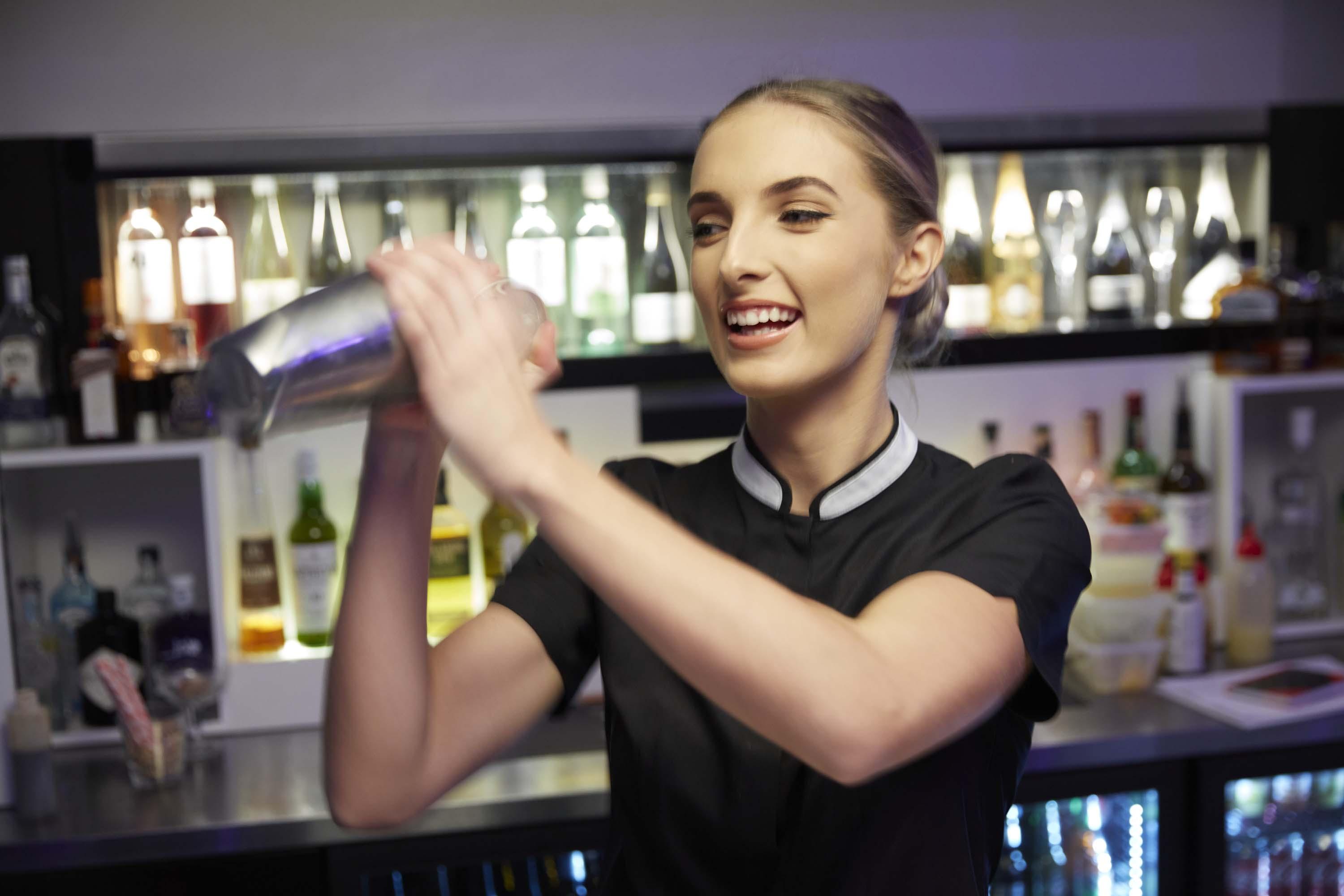 The Point Brisbane Hotel Luaran gambar A bartender shaking a cocktail
